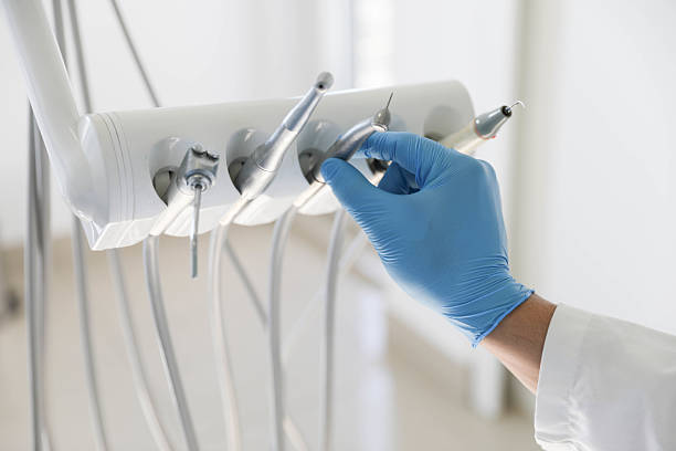 Professional Tooth Extraction technician working in Greensboro, NC
